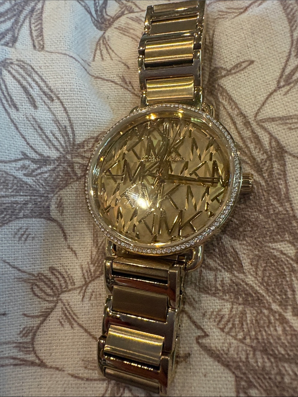 Michael Kors Gold-Tone Monogram Dial Crystal Bezel Watch